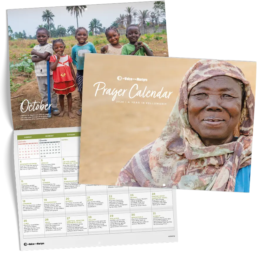 Front cover of calendar showing woman praying