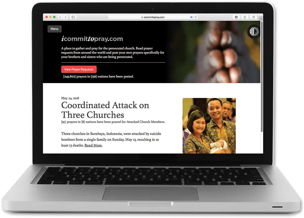 Laptop with browser showing icommittopray.com